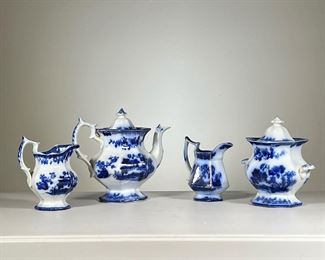 (4pc) Blue & White Floral Vessels | Blue and white porcelain vessels including: lidded teapot; Ironstone Pelew polygonal creamer; serpentine creamer; and a lidded jar with small handles. - w. 9 x h. 8.5 in (teapot)