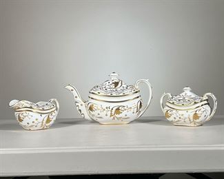 (3pc) Tiffany & Co. Tea Set | Three pieces from the Tiffany and Co. Grosvenor tea collection: a creamer, lidded sugar bowl, and a large lidded teapot with leafy gilt decoration. -  l. 10.5 x w. 5 x h. 6 in (teapot)