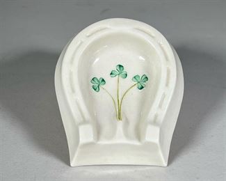 Lucky Belleek Ashtray | Ceramic ashtray shaped like a horseshoe with green clover motif. - l. 3 x w. 4.5 in