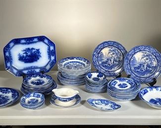 Large Lot Of Blue And White | Large lot of assorted blue and white dinnerware; includes various plates, saucers, a gravy boat and platters; makers include WH Grindley, Royal Cauldon and Copeland. -  l. 13.5 x w. 10 in (largest platter)