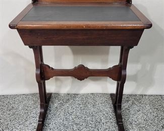 A Childs Antique School Desk with the original glass lined Inkwell. 