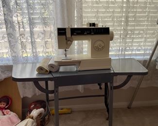 Sewing machine and folding metal table