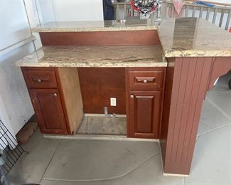 Kitchen island/bar with electrical outlets  and beautiful granite tops