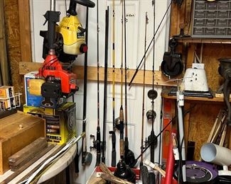 HUGE collection of fishing poles w/reels. 40+