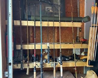 HUGE collection of fishing poles w/reels. 40+