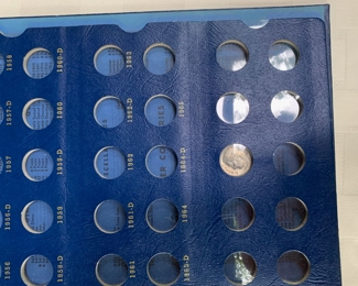 Assorted coin holder books