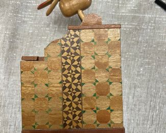 1940s vintage bird cigarette grabber; wood inlay