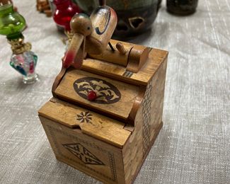 1940s vintage bird cigarette grabber with wood inlay; signed "Made in Japan"