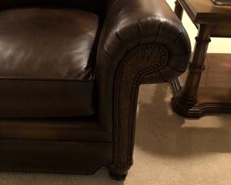 DETAILS OF ARM OF LEATHER SOFA