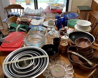 Lots of pyrex cookware, stainless steel bowls, table linens