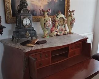 Marble top secretary and antique clocks