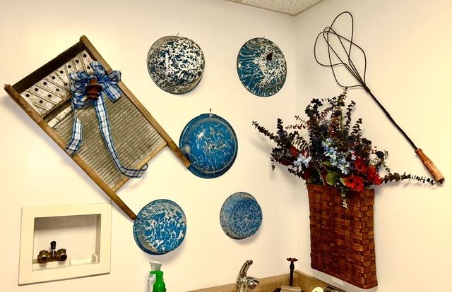 Vintage washboard, blue & white enamelware, rug beater, etc.