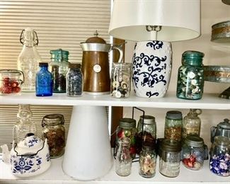 A large collection of vintage & antique kitchen collectibles, jar of buttons, teapots, advertising bottles (Some SOLD)