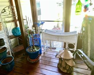 Metal stand w/ woven shelves, planters, garden art