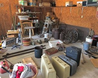 Antique wagon wheels, antique milk cans, miscellaneous antiques, furniture pads, ladders, luggage, soda bottle crate, mirrors, etc.