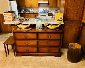 Antique barrel, dresser, kitchen dishes, utensils, glassware, appliances, refrigerator.
