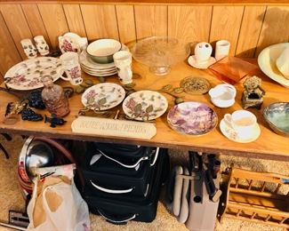 Beautiful grape dishware set, new luggage, Kirby vacuum cleaner, kitchen dishes.