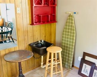 End table, ironing board, wall shelf, artwork