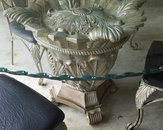 A closer look at the table's pedestal and glass top