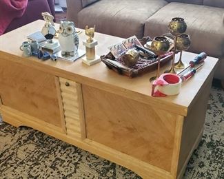 Antique trunk has a thin shelf that raise with lid.  Making main trunk items accessible while items on shelf are also accessible.