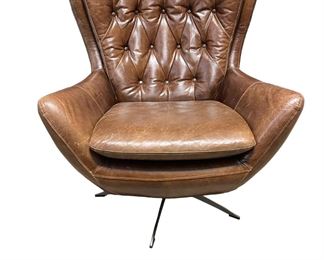 $800 USD     Pottery Barn Brown Swivel Leather Tufted Back Chair HR177-10     According to the Pottery Barn website: "A swivel chair couldn't get more inviting than this. Plush and roomy, [the] Wells Leather Tufted Armchair is wrapped in top-grain leather for sink-in comfort. Rich leather creates a beautiful counterpoint to the exposed metal base. The modified wingback design makes a statement in any space. The versatile swivel base lets you move swiftly between vantage points." Its rich molasses leather brings the old-school charm and comfort, but the brushed nickel base modernizes the look of this bestseller. Note that this chair is made from real leather, which will show scratches and wear over time, which builds its personality. "Our leathers appeal to customers who find the natural color variations, markings and patina of pure aniline leathers unique and beautiful. They may not appeal to customers who want uniform color and surface commonly seen on less expensive leathers that are
