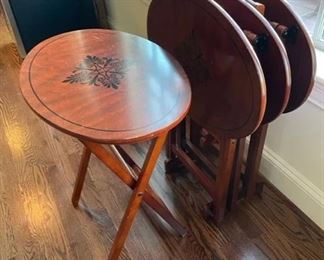 $35 USD     Set of 4 Folding TV Tables/Wood Tables CD131-16     Description: Remember when?  These TV trays/tables are upgraded wih a lovely painted leafy center medallion.  Perfect for movie night!
Condition: Very good condition.
Dimensions: 23 x 16 x 27 in
Local pick up Leesburg, VA.  Contact us for shipper suggestions.     https://goodbyhello.com/products/set-of-4-folding-wood-tables-cd131-16?_pos=5&_sid=a8960360b&_ss=r