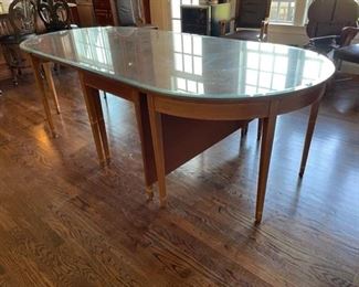 $2,370 USD     Chippendale Marlborough Style Drop Leaf Table CD131-11    Description:  Versatile, Chippendale mahogany drop leaf table with Marlborough style legs that opens up to seat four, seating up to eight with two D ends. Table has four central fixed legs and two mid-side pull-out legs that support the drop sides. D ends attach with brass attachment clips that join the drop side to the D-ends. Table includes a set of fully fitted pads for the entire table including D ends. When closed can make a good sofa table. The two D ends are great as console or serving tables.
Condition: Good condition with custom glass top
Dimensions: 103 x 48 x 30"H. 24" Drop Leaf
Local pick up Leesburg, VA.  Contact us for shipper suggestions.     https://goodbyhello.com/products/drop-leaf-wood-table-w-inlay-cd131-11?_pos=21&_sid=a8960360b&_ss=r