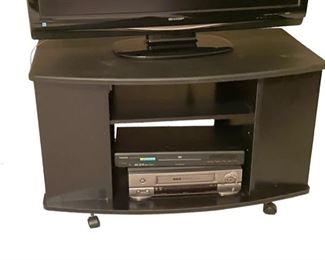 $50 USD      Black Curved Front TV Stand w Open Center & Side Shelving CD131-44     Description:  Add a great accent to accommodate your TV with this curved front TV stand. The unique style includes a black frame with two open shelves providing space for media components.
Condition: Good 
Dimensions: 36 x 20 x 20"H
Local pick up Leesburg, VA.  Contact us for shipper suggestions.      https://goodbyhello.com/products/black-tv-stand-w-side-shelves-cd131-44?_pos=33&_sid=a8960360b&_ss=r