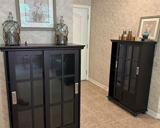 Sliding door black display cabinets - framed pictures