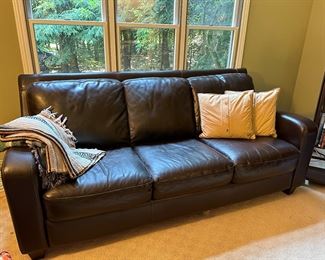 Brown couch with three cushions as found