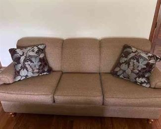 3 Seat Couch Upholstered In Brown Fabric With 2 Pillows