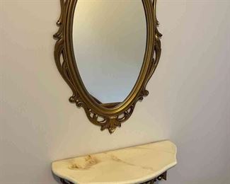 Mirror and small marble top shelf