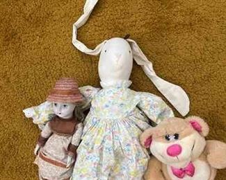 Stuffed rabbit, bear, and baby doll