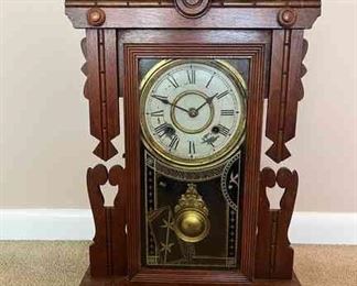 Vintage windup clock in carved wood design