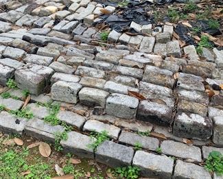Hundreds of granite cobblestones removed from Church Street  in Nashville many years ago. Similar to what we would call Belgian pavers. Approximately 1,300 stones. 
These are available for pre-sale. Call to inquire. Hundreds available.