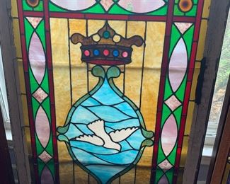 Holy Spirit window in wood frame