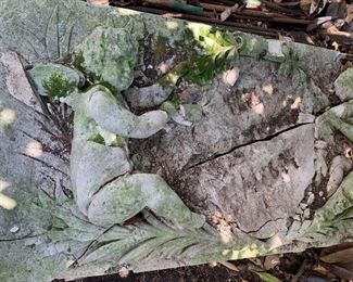 Broken carved pediment with two angels
