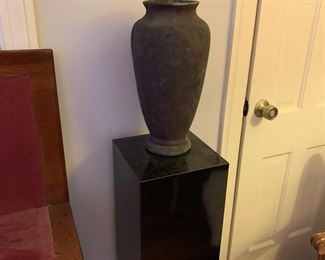 Black pedestal and Mud River Pottery vase