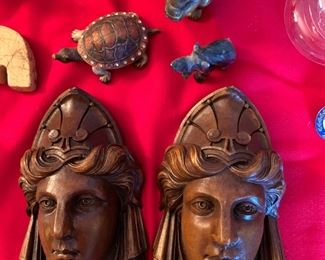 pair of carved wood faces