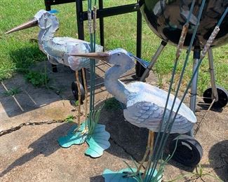 Large metal egrets or herons