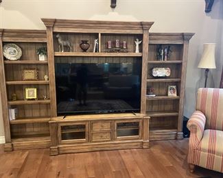 . . . a great rustic finished wall unit -- notice large flat screen and treasures