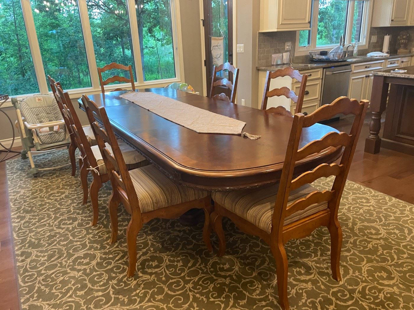. . . a beautiful formal dining room set with large area rug