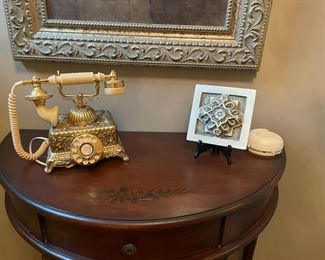 . . . nice wall table with vintage-style phone and accent tile