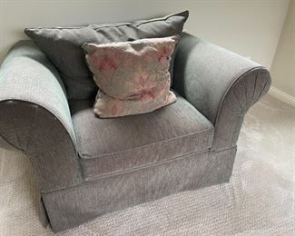 . . . inviting accent chair in grey tones