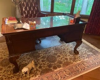 . . . wonderful executive desk with ball-and-claw feet -- notice cute pug in foreground