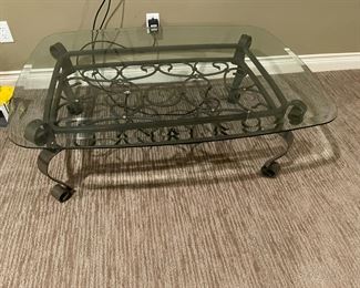 . . . glass and wrought-iron coffee table