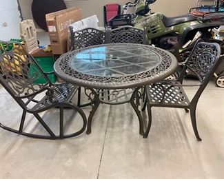 . . . great patio table with complimentary chairs and rocker
