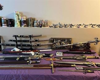 Several swords. Also, a bayonet (sold) and a Stag knife.