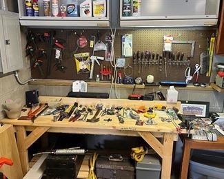 Lots of hand tools, toolboxes, tape measures, levels. 