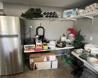 Folding chairs, Cabela's meat slicer, popcorn maker, George Foreman, Crock pot, vacuum food sealer, Christmas tree, snowman. 